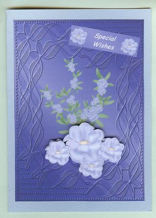 Pale Blue Flowers on Sapphire Embossed Background by Christine Dixon
