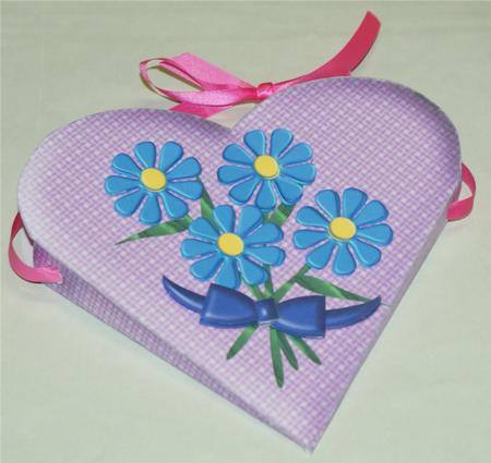 Three Stylised Flowers with a Bow by Christine Dixon