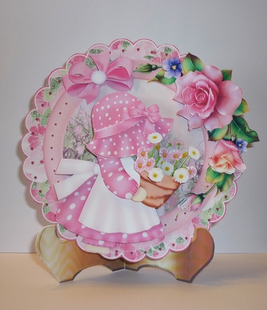 Little Flower Lady in the Pink Scalloped Round Easel Card by Cornelia Orgahs