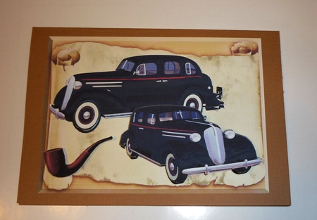 Black Sedans on a scroll, with vintage smoking pipe by Cornelia Orgahs