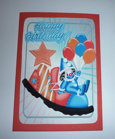 Jolly little clown in blue sat on clowns shoe with peach star  A5 by Cornelia Orgahs