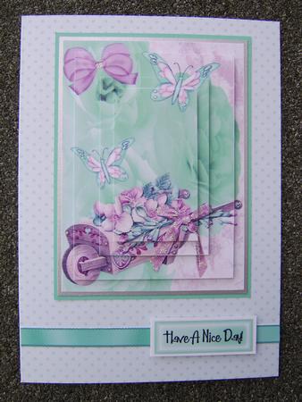 Wheelbarrow of Flowers, & Butterflies, Pyramids by Corrine Penhale