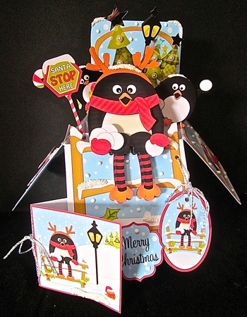 3D Christmas Rubber Band Pop Up Box Card - Pip Penguin goes Snowballing  by Cynthia Massey