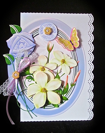 Lilac and cream flowers in oval frame by Cynthia Massey