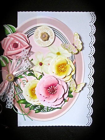 Pink and cream flowers in oval frame by Cynthia Massey
