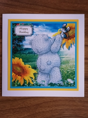 Tatty teddy helping little mouse down from sunflower by D A Boscoe