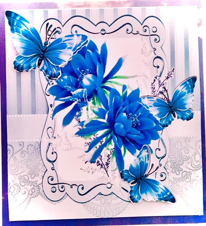 Pretty blue flowers in ornate 8x8 frame with butterflies by Darlene Handorff