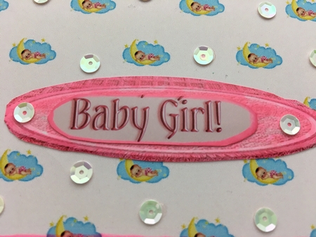 A4 pink backing paper with a baby girl on a cloud. by Darlene Handorff