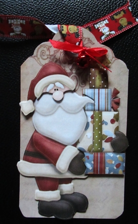 Santa with Lots of Pressies on a Tag by Davina Rundle