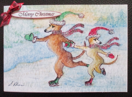 Greyhound dogs ice-skating on a frozen lake Christmas scene, wavy edged stacker topper by Davina Rundle