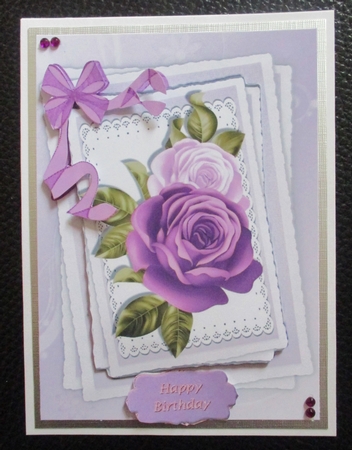 Pretty purple painted roses on lace with organza bow by Davina Rundle