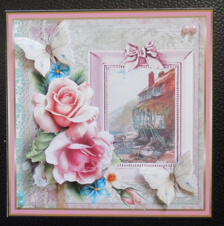 Rose and fishing village by Davina Rundle