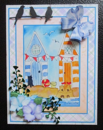 A5 beach scene with beach huts and black cat. Card topper with decoupage by Davina Rundle