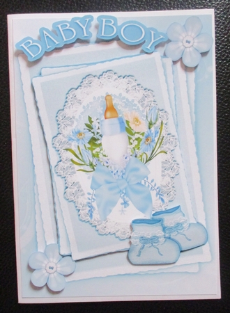 Blue for baby boy with bottle.bootees & bow on lace stackers A5 by Davina Rundle