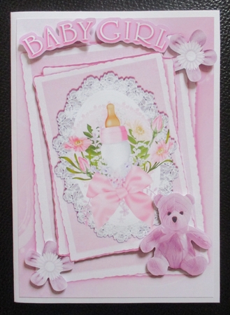 pink for baby girl with bottle.teddy & bow on lace stackers A5 by Davina Rundle