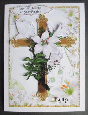 pretty white lilies, gold cross with white dove for sympathy by Davina Rundle