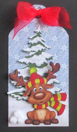 Cute reindeer in wooly hat & scarf on a tag by Davina Rundle