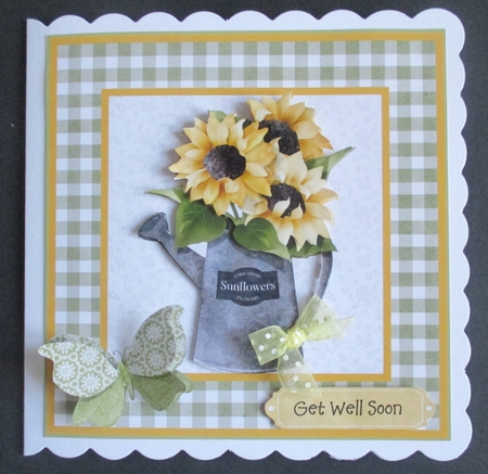 sunflowers in a watering can by Davina Rundle