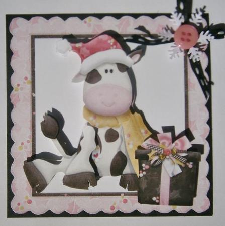 Little Cow Sitting in Santa Hat with Present by Davina Rundle