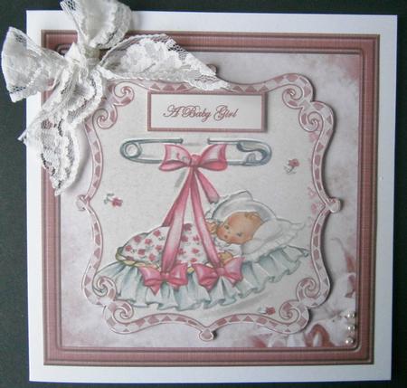 New Baby Girl in a Crib Card Front and Toppers by Davina Rundle
