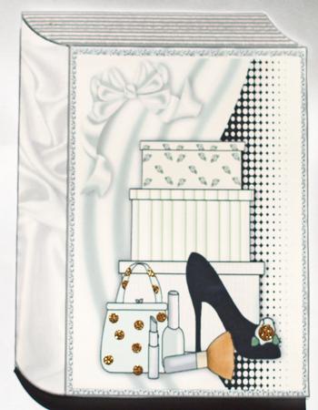 Shoes and Girlie Stuff on Folded Book by Dawn Jones