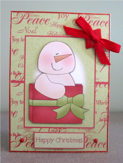 Christmas Snow Man with Xmas Present Over the Edge Card by Debbie Knechtel