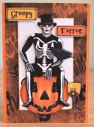 Skelly Man Sitting on Pumpkin with Crow by Debbie Knechtel