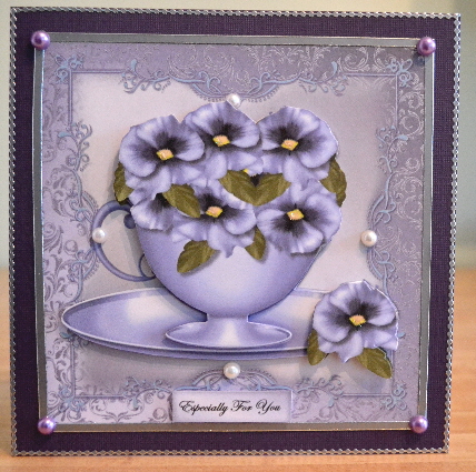 Teacup Pansies by Debbie Knechtel