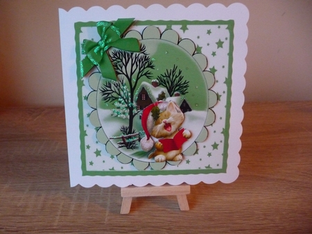lovely snow scene with cottage, stars and kitten green bow 8x8 card front by Debbie Whyte