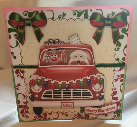 Christmas santa in a car with rudolph and presents (red) 8x8 by Debbie Wilde