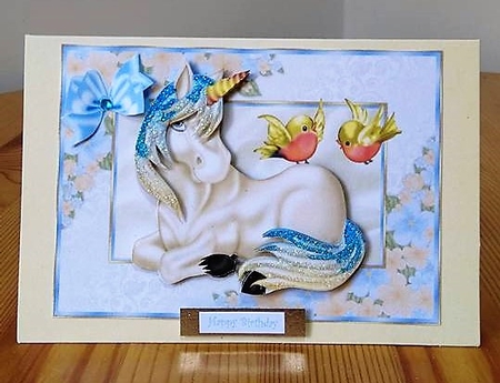 Little Unicorn with Love Birds in a Floral Frame by Debby Bloor