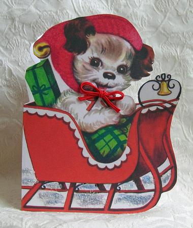 Christmas Dog in Sleigh by Debra Laraway