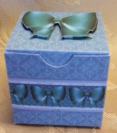 Small gift box with bows by Deloraine Neubauer