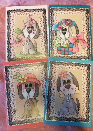 4 Black and orange cute puppy toppers by Deloraine Neubauer