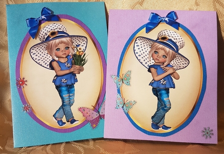 Two lovely card fronts of little girls in blue hats and bows by Deloraine Neubauer