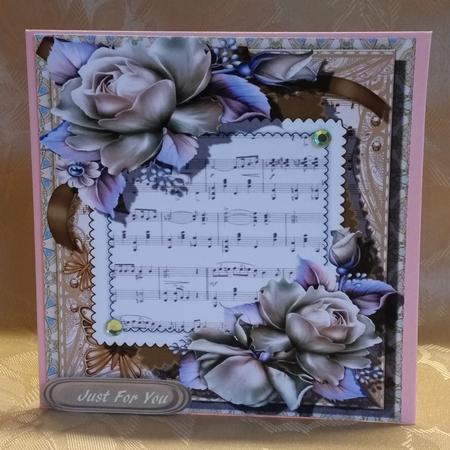 Lovely Roses on Shet Music ,buff by Deloraine Neubauer
