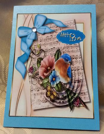 Lovely Pyramid Bird on Sheet Music  by Deloraine Neubauer