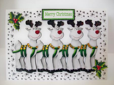 Santas Reindeers with Holly in Star Frame by Denise Mynard