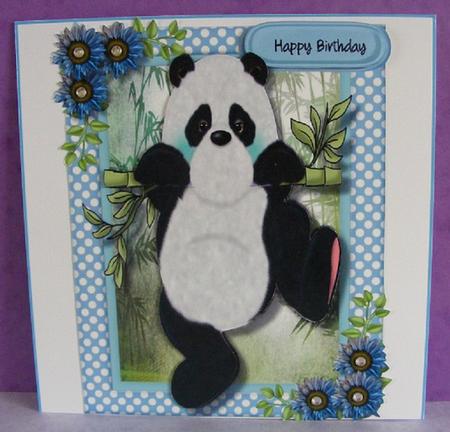 Lovely Blue Pand Swinging on a Cane  by Diana Holmes