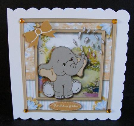 Lovely Buff Ellie Watering the Garden by Diana Holmes