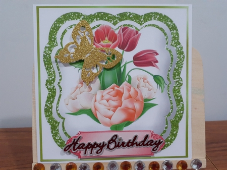 Pretty peach  flowers in green glitter ornate 7x7 topper by Diane Carbis