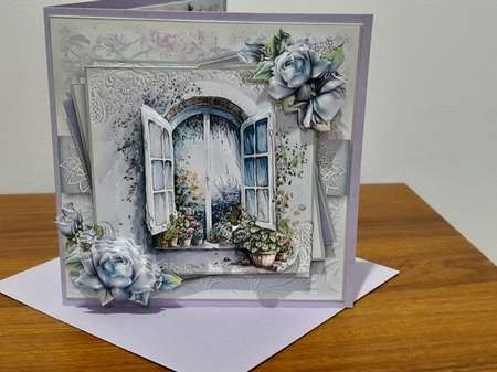 An arched floral window by Diane Carbis