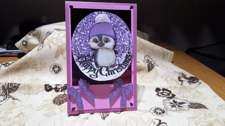 Cute pengy in purple bobble hat rocker card by Diane Carbis