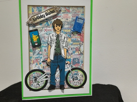 Teenage boy with bike and marvel comics by Diane Carbis