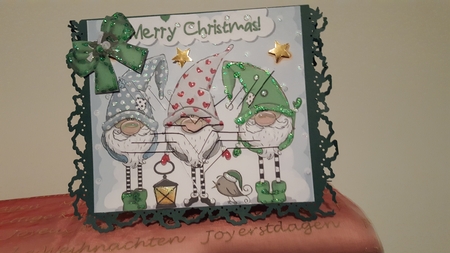 Trio of santas elves with bow and star pyramids (green) by Diane Carbis
