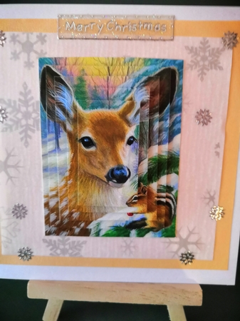 Pretty deer with chipmunk in the snow pyramids by Diane Dawson