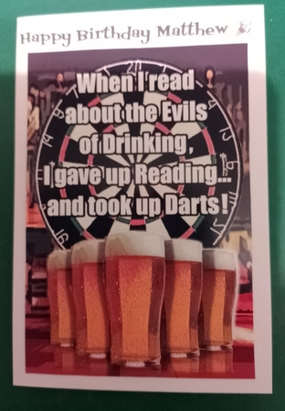 Dartboard and Pints of Beer on Pub Bar by Diane Gray