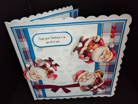 Tumbling Santas by Diane  Hitchcox