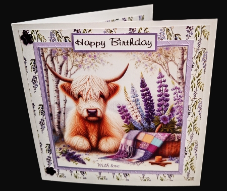 highland coo with flowers by Diane  Hitchcox