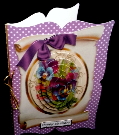 pretty shades of purple pansies on a scroll oval pyramids by Diane  Hitchcox